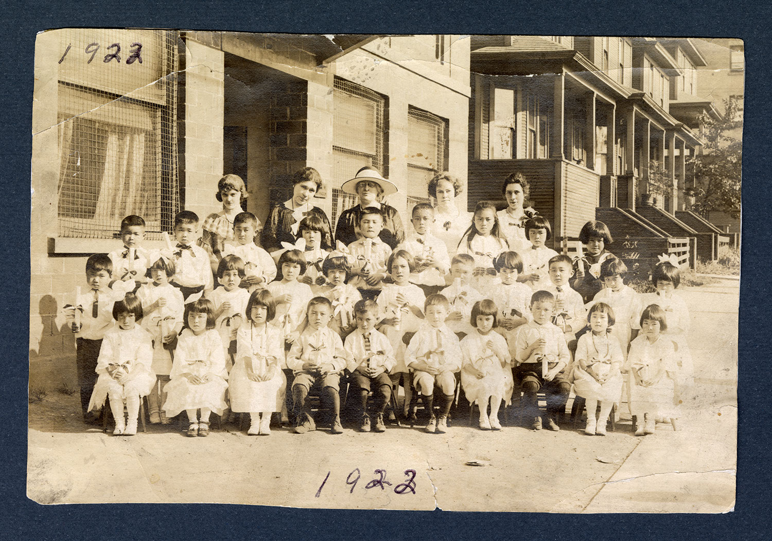 Kindergarten graduates and teachers, 1922: Recto