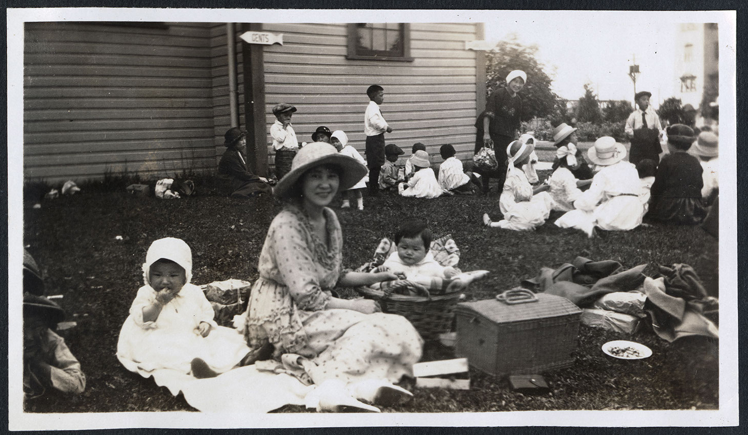 Toddlers and parents having a picnic